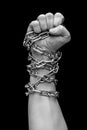 Fist of man in chains. Black and white