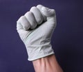 Fist in medical glove