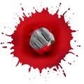 Fist punches through a red spot Royalty Free Stock Photo