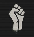 Fist raised in protest. Fist icon isolated on a brick wall. Vector illustration