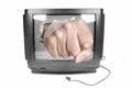 Fist smashes TV screen Royalty Free Stock Photo