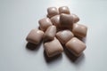 Fistful of pink pieces of chewing gum Royalty Free Stock Photo