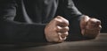 Fists of angry man beats on the table Royalty Free Stock Photo