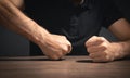 Fists of angry man beats on the table Royalty Free Stock Photo