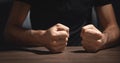 Fists of angry man beats on the table Royalty Free Stock Photo
