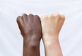 Fists of the hands of a black and white man. Protest against racial discrimination. The concept of ending racism
