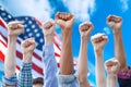 Fists Raised for Human Rights on American flag background Royalty Free Stock Photo