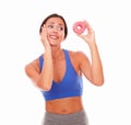 Fit adult woman choosing sugary food