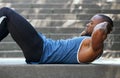 Fit african american man doing stomach crunches