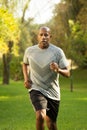Fit African American man running. Royalty Free Stock Photo