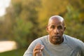 Mature fit African American man running outside. Royalty Free Stock Photo