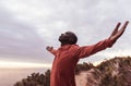 Fit African man standing on a trail outdoors embracing nature Royalty Free Stock Photo