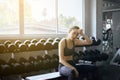 Fit asian beuatiful woman sitting and relax after the training session in gym,Concept healthy and lifestyle,Female taking a break Royalty Free Stock Photo