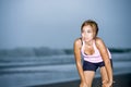 Fit Asian Sport Runner Woman Cooling Off Breathing After Running On Beach Sea Side Looking Tired While Hard Workout