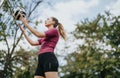 Fit athlete in the park, training outdoors and performing football freestyling tricks. Royalty Free Stock Photo