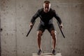 Fit athletic young man doing exercises with heavy weight barbell plate Royalty Free Stock Photo