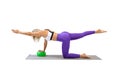 Fit beautiful woman does pilates balance drill with a small rubber ball under her hand, one leg and arm up, isolated on