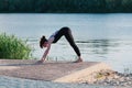 Fit female practice yoga exercise in the open Royalty Free Stock Photo