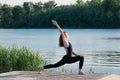 Fit pretty female practice yoga exercise outdoors Royalty Free Stock Photo