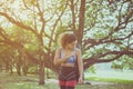 Fit black woman standing and holding yoga mat after break workout at park,Happy and smiling,Relaxing time,Positive thinking Royalty Free Stock Photo