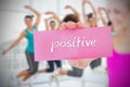 Fit blonde holding card saying positive