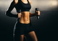 Fit body of beautiful, healthy and sporty girl. Slim woman posing in sportswear. Royalty Free Stock Photo