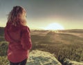 Fit body blond hair woman on the top of the high rock