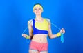 Fit body. Sport skipping rope equipment. Athletic fitness. Happy woman workout with jump rope. Strong muscles and power Royalty Free Stock Photo