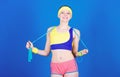 Fit body. Sport skipping rope equipment. Athletic fitness. Happy woman workout with jump rope. Strong muscles and power Royalty Free Stock Photo