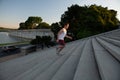 Fit Caucasian man running up steps for an outdoor workout