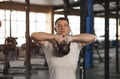 Fit And Concentrated Young Man Training With Kettlebell in Gym. Royalty Free Stock Photo