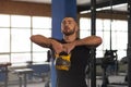 Fit And Concentrated Young Man Training With Kettlebell in Gym. Royalty Free Stock Photo