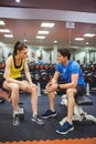 Fit couple chatting in weights room Royalty Free Stock Photo