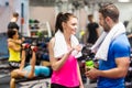 Fit couple chatting in weights room Royalty Free Stock Photo