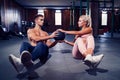 Fit couple doing abdominal ball exercise at gym Royalty Free Stock Photo