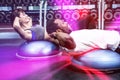 Fit couple doing bosu ball exercises Royalty Free Stock Photo