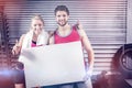 Fit couple holding blank paper Royalty Free Stock Photo