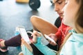Fit couple in modern crossfit gym with smartphone. Royalty Free Stock Photo