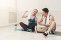 Fit couple with smartphone listening to music Royalty Free Stock Photo