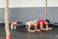 Fit couple planking together in gym Royalty Free Stock Photo