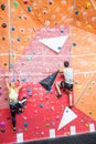 Fit couple rock climbing indoors Royalty Free Stock Photo