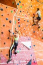 Fit couple rock climbing indoors Royalty Free Stock Photo