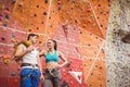 Fit couple at the rock climbing wall Royalty Free Stock Photo