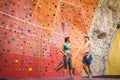 Fit couple at the rock climbing wall Royalty Free Stock Photo