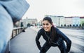 A fit couple runners stretching outdoors on the streets of Prague city. Royalty Free Stock Photo