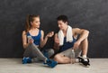 Fit couple with smartphone listening to music Royalty Free Stock Photo