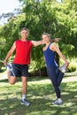 Fit couple stretching in the park Royalty Free Stock Photo