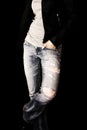 Fit female body in blue jeans, isolated on black background Royalty Free Stock Photo