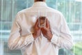 Fit flexible business man with glass of water