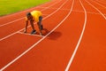 Fit focused confident african american runner sportsman in trendy sportswear standing in starting position ready to run